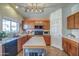 Well-lit kitchen offering plentiful counter space and modern stainless steel appliances at 214 N 222Nd Dr, Buckeye, AZ 85326