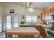 Bright kitchen with an island, a double door, and a window at 214 N 222Nd Dr, Buckeye, AZ 85326