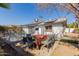 Inviting backyard patio with solar panels, featuring a charming outdoor dining area at 2143 W Eugie Ave, Phoenix, AZ 85029