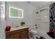 Bathroom featuring a vanity with sink, toilet, and a walk-in shower at 2143 W Eugie Ave, Phoenix, AZ 85029