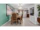 Formal dining room with an elegant chandelier, artwork, and neutral-toned decor at 2143 W Eugie Ave, Phoenix, AZ 85029