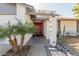 Inviting front entrance with decorative pergola, palm trees, and cacti at 2143 W Eugie Ave, Phoenix, AZ 85029