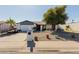 Charming single-story home featuring desert landscaping and a well-maintained front yard at 2143 W Eugie Ave, Phoenix, AZ 85029