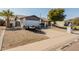 Charming single-story home featuring desert landscaping and a well-maintained front yard at 2143 W Eugie Ave, Phoenix, AZ 85029