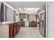 Functional kitchen featuring a skylight, ample counter space, and stainless steel appliances at 2143 W Eugie Ave, Phoenix, AZ 85029