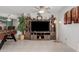 Living room view featuring a decorative media center and access to the dining area at 2143 W Eugie Ave, Phoenix, AZ 85029