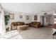 Spacious living room featuring tile floors and classic furnishings at 2143 W Eugie Ave, Phoenix, AZ 85029