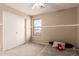 Cozy bedroom with a ceiling fan, plush carpet, and a sliding door closet at 2190 W San Tan Hills Dr, San Tan Valley, AZ 85144