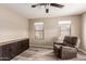 Bedroom with wood floors, ceiling fan, storage cabinet and large window with a view at 2190 W San Tan Hills Dr, San Tan Valley, AZ 85144