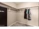 Organized walk-in closet with upper shelving and hanging rods at 2190 W San Tan Hills Dr, San Tan Valley, AZ 85144