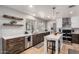 Stylish kitchen with dark wood cabinets, white countertops, stainless steel appliances, and a functional island at 2237 N Kachina --, Mesa, AZ 85203