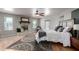 This main bedroom features a stone fireplace, ceiling fan and hardwood floors at 2237 N Kachina --, Mesa, AZ 85203