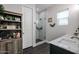 Bathroom featuring a double sink vanity and a beautifully tiled walk-in shower with a glass enclosure at 2246 E Sheridan St, Phoenix, AZ 85006