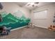 Unique bedroom featuring a creative mountain mural and playful decor at 2246 E Sheridan St, Phoenix, AZ 85006