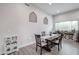 Bright dining area with decorative wall accents, a dark wood table, and plank flooring at 2246 E Sheridan St, Phoenix, AZ 85006