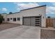 Two-car garage showcasing a sleek, contemporary door design and ample parking space at 2246 E Sheridan St, Phoenix, AZ 85006