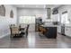 Bright dining area adjacent to a modern kitchen with stainless steel appliances and a stylish island at 2246 E Sheridan St, Phoenix, AZ 85006