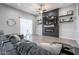 Inviting living room features modern fireplace, floating shelves and view to rear yard at 2246 E Sheridan St, Phoenix, AZ 85006