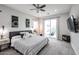 Bright main bedroom boasts a ceiling fan, sliding glass door, and neutral tones for a relaxing atmosphere at 2246 E Sheridan St, Phoenix, AZ 85006