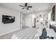 Bright primary bedroom features a ceiling fan and neutral tones, creating a relaxing atmosphere at 2246 E Sheridan St, Phoenix, AZ 85006