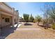 Backyard featuring a covered patio, gravel landscaping, mature trees and privacy fencing at 26234 N 46Th St, Phoenix, AZ 85050