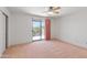 Bedroom with neutral walls and sliding glass doors leading to a balcony at 26234 N 46Th St, Phoenix, AZ 85050