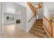 Open concept entryway with stairway, tile floor, and view of the living room at 26234 N 46Th St, Phoenix, AZ 85050