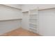 Walk in closet features shelving and rails at 26234 N 46Th St, Phoenix, AZ 85050