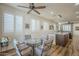 Cozy dining area with modern light fixture, window shutters, and a glass table at 2673 S Balsam Dr, Gilbert, AZ 85295