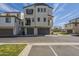 Contemporary three-story townhome with attached garage and balcony at 2673 S Balsam Dr, Gilbert, AZ 85295