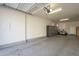 Spacious garage with epoxy flooring, storage cabinets, and ample room at 2673 S Balsam Dr, Gilbert, AZ 85295