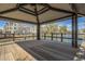 Interior view of a covered gazebo overlooking a tranquil pond and walkways at 2673 S Balsam Dr, Gilbert, AZ 85295