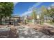 Community gazebo on a wooden deck offering serene views of the pond and surrounding landscaping at 2673 S Balsam Dr, Gilbert, AZ 85295