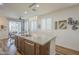 Bright kitchen features a kitchen island with granite countertops and stainless steel appliances at 2673 S Balsam Dr, Gilbert, AZ 85295