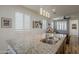 Stylish kitchen featuring a granite counter top, sink, pendant lights, and modern finishes at 2673 S Balsam Dr, Gilbert, AZ 85295