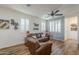 Well-lit living room showcasing hardwood floors, modern decor, and comfortable seating at 2673 S Balsam Dr, Gilbert, AZ 85295