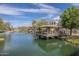 Community pond with a gazebo and fountain, surrounded by lush landscaping and blue sky at 2673 S Balsam Dr, Gilbert, AZ 85295