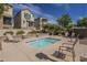 Community spa surrounded by lounge chairs with lush landscape, perfect for relaxing outdoors at 2673 S Balsam Dr, Gilbert, AZ 85295