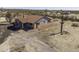 Aerial view of a charming single-story home in a desert landscape, featuring a red tile roof at 27141 E Javelina Dr, Florence, AZ 85132