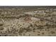 Aerial view of a single-story home with a red tile roof in the desert at 27141 E Javelina Dr, Florence, AZ 85132