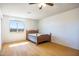 Bedroom featuring laminate floors, a ceiling fan, and a window at 27141 E Javelina Dr, Florence, AZ 85132