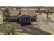 Aerial view of a single-story ranch style home with a red tile roof in the Arizona desert at 27141 E Javelina Dr, Florence, AZ 85132