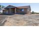 Front exterior view of a ranch-style home with a red tile roof in the Arizona desert at 27141 E Javelina Dr, Florence, AZ 85132