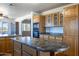 Spacious kitchen featuring wood cabinets, an island, and modern appliances at 27141 E Javelina Dr, Florence, AZ 85132