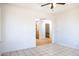 Open-concept living room with tile floors connecting to the kitchen and bathroom at 27141 E Javelina Dr, Florence, AZ 85132