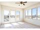 Sunroom with a ceiling fan, tile flooring, and lots of natural light at 27141 E Javelina Dr, Florence, AZ 85132