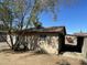 The back of the house features a covered carport and desert landscaping at 2837 W Almeria Rd, Phoenix, AZ 85009