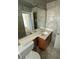 This bathroom features a large mirror above the sink, with a toilet to the side at 2837 W Almeria Rd, Phoenix, AZ 85009