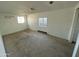 Spacious bedroom featuring light walls, carpet and natural light from two windows at 2837 W Almeria Rd, Phoenix, AZ 85009