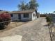 A white house with a gravel driveway and chain link fence at 2837 W Almeria Rd, Phoenix, AZ 85009